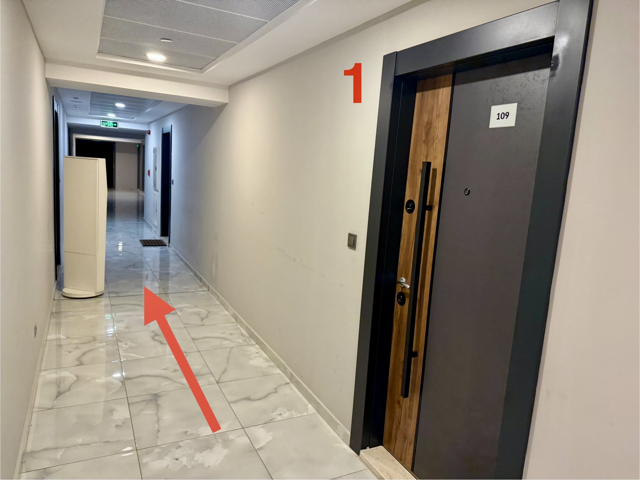 Exit apartment 109 and turn right into hallway